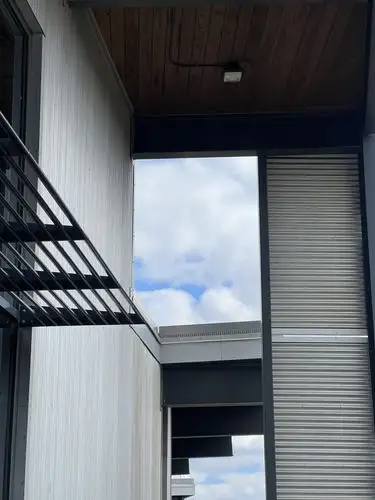Geometric lines meet the open sky.